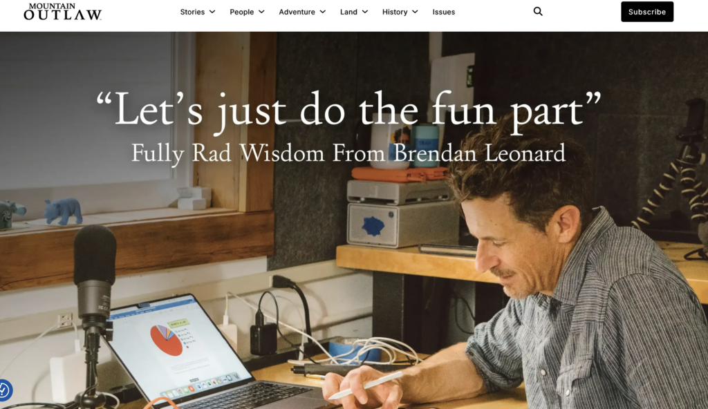screengrab from mountain outlaw article about brendan leonard sitting at desk and drawing