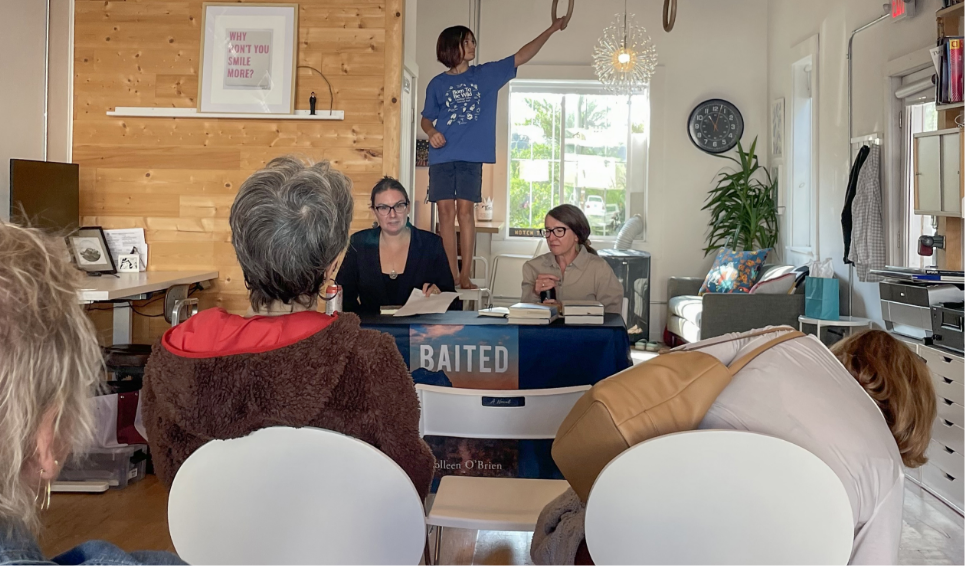 Maggie speaking at a literary event at Highline Design in Kalispell, Montana
